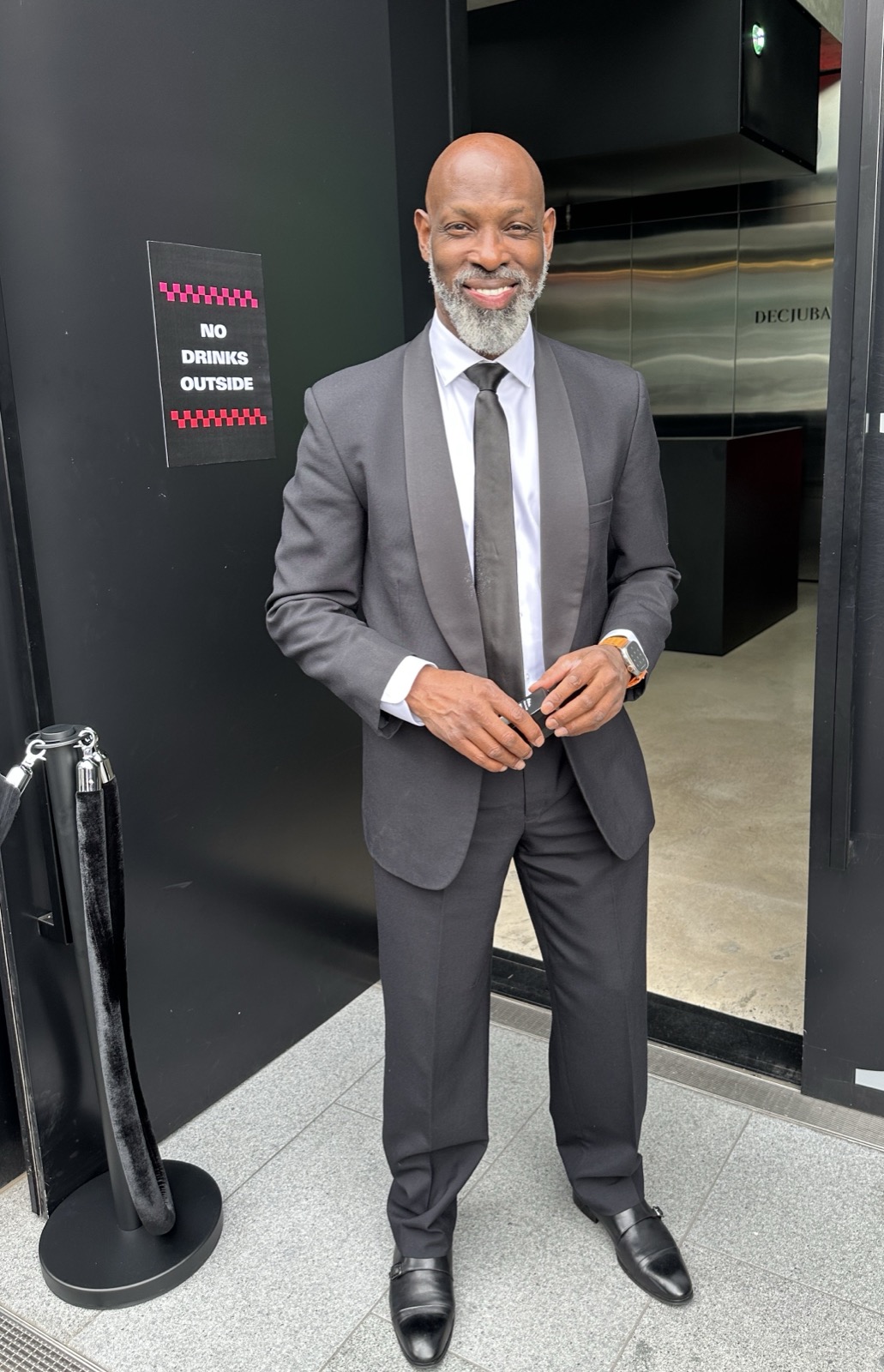 Aubrey Gardner hosting at a venue entrance, Melbourne